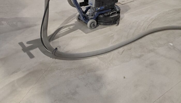 grinding and vacuuming - love our new machine! concrete flooring coatings