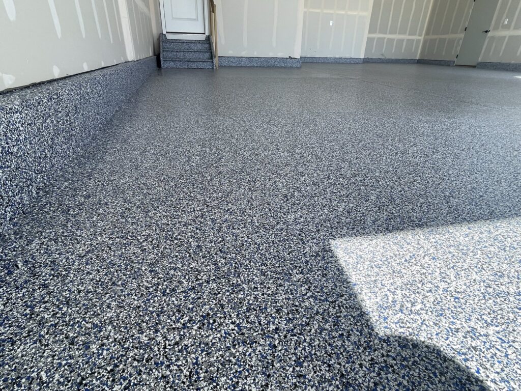 Timber Ridge development involved transforming a spacious 3.5-car garage with our Lakeshore polyaspartic floor coating