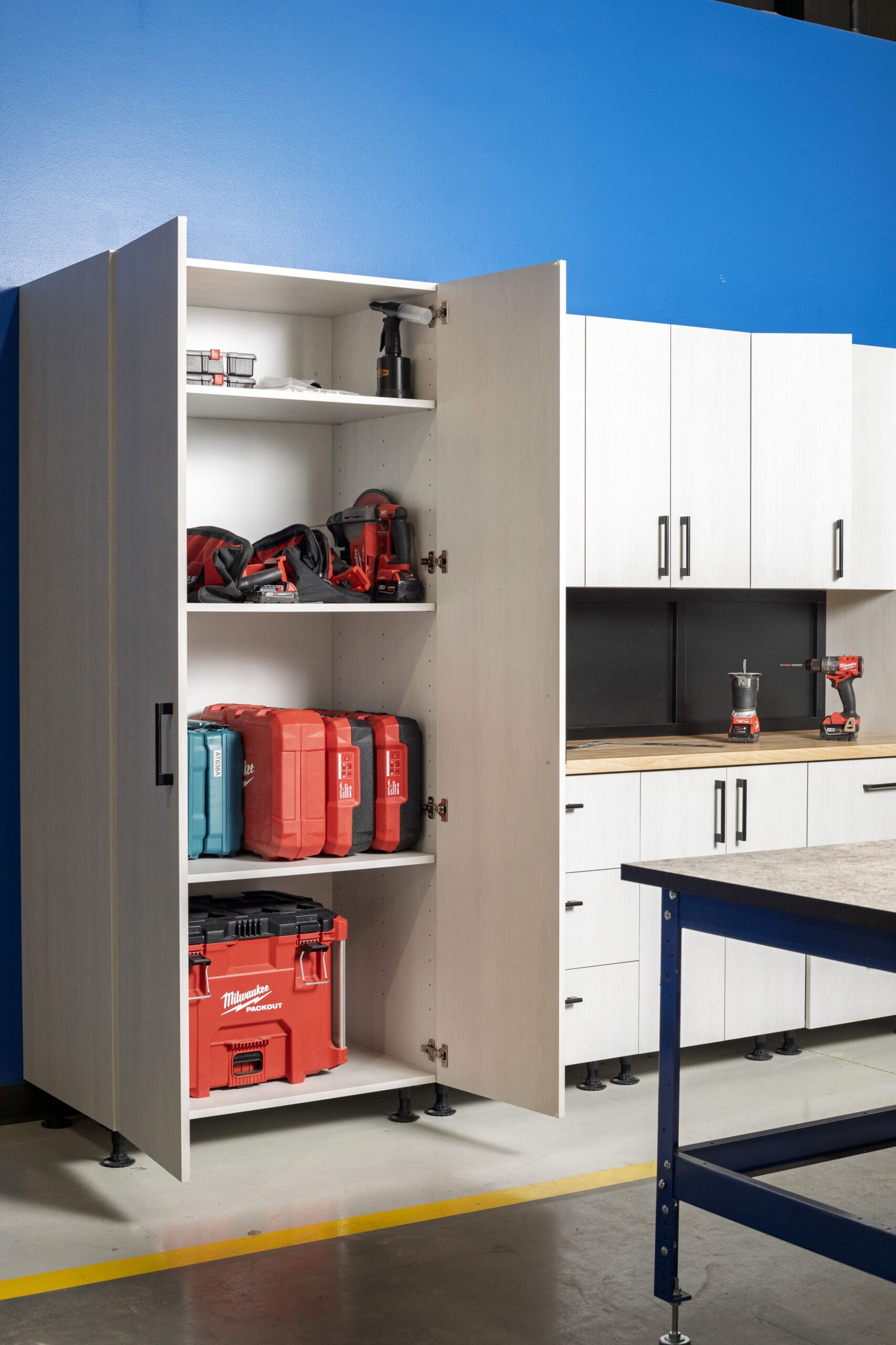 White garage cabinets with butcher block countertops