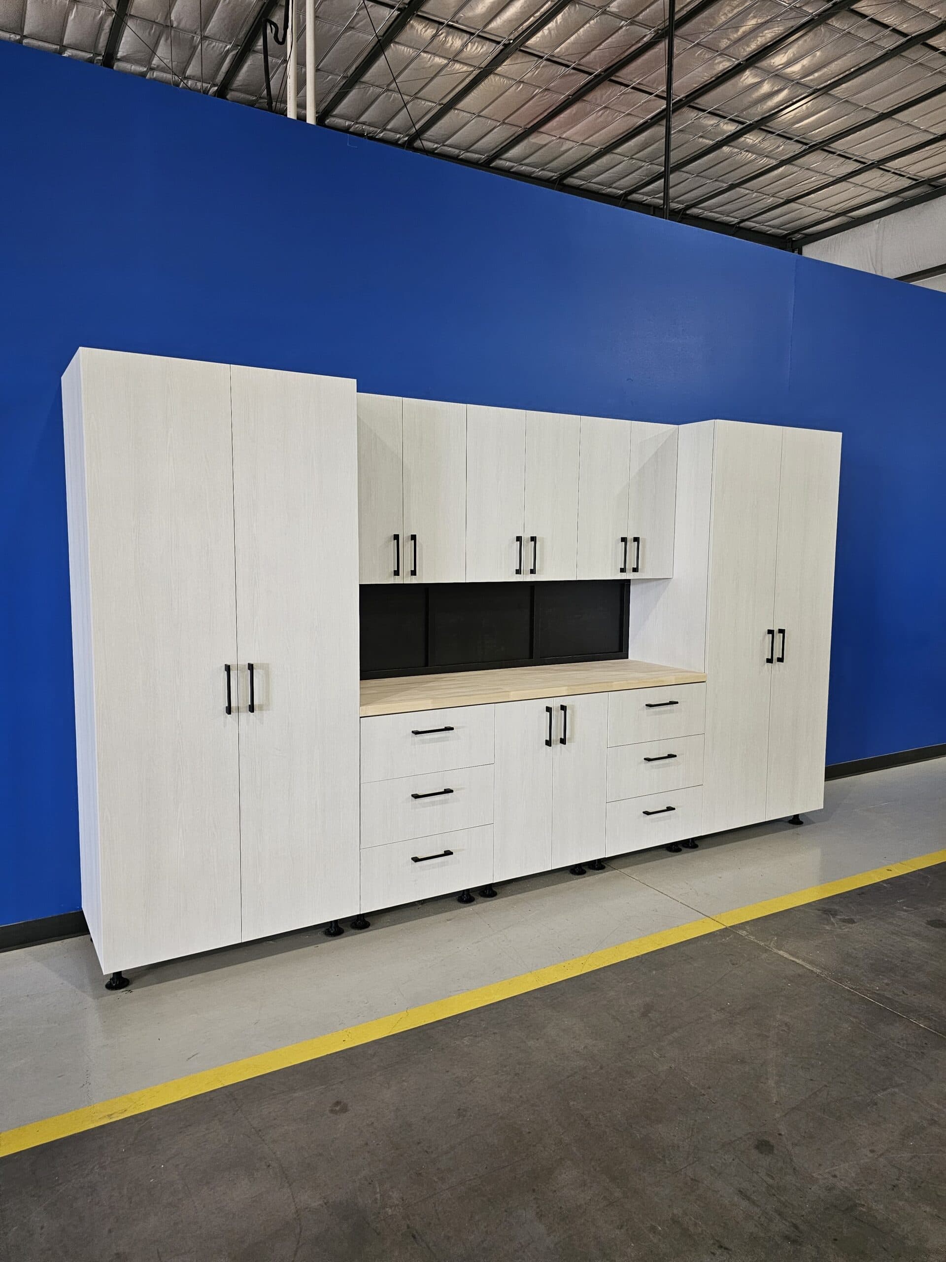 White garage cabinet system with butcher block countertop installed — Colorado Springs Garage Floors